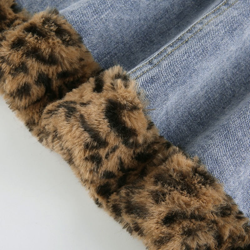 Close-up of Women's Furry Leopard High Waist Jeans Skirt with leopard fur inserts and denim fabric.