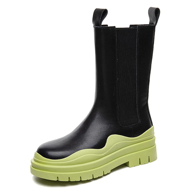 Women's genuine leather black boots with a stylish thick green sole for ultimate comfort and fashion flair.