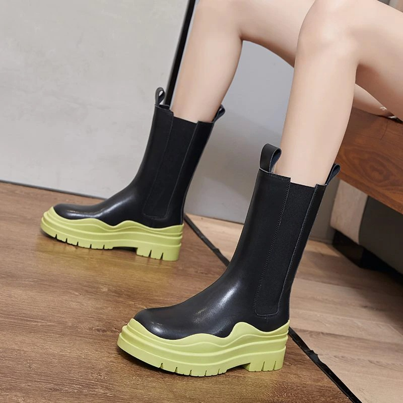 Stylish women's genuine leather boots with thick green sole, ideal for fashion-forward ladies looking for comfort and style.