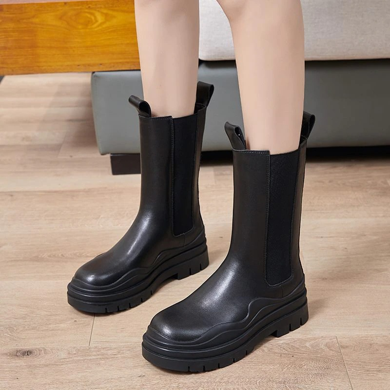 Stylish women's genuine leather boots on thick sole, perfect for all-day comfort and fashion-forward looks.