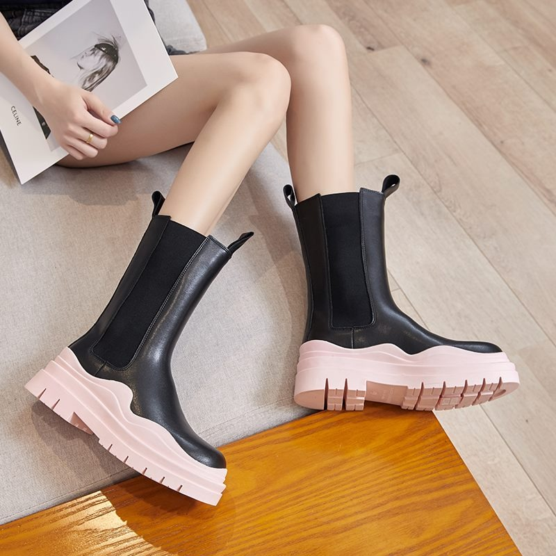 Stylish women's genuine leather boots with thick pink sole, perfect for all-day comfort and fashion-forward looks.