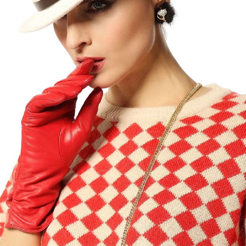 Elegant woman in red leather gloves, showcasing a chic casual look with a checkered sweater and stylish hat.