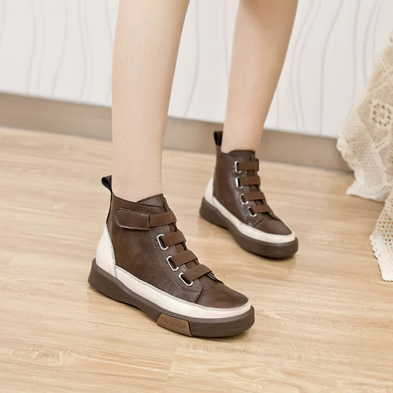 Stylish women's genuine leather sneakers in brown, featuring trendy round toe and velcro straps for comfy style.