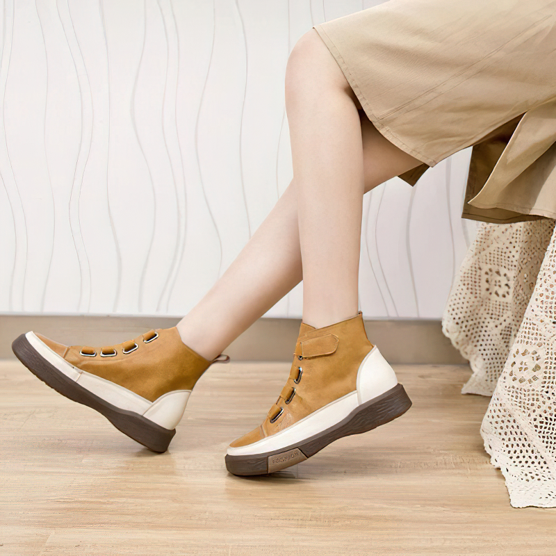 Trendy women's genuine leather sneakers with round toe, featured in stylish tan color, ideal for casual wear.