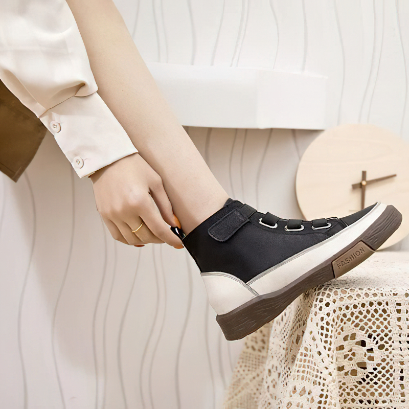 Stylish women's black genuine leather sneakers with velcro straps for trendy casual wear.