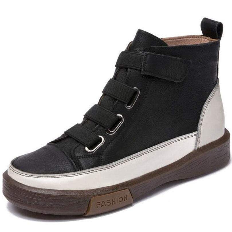 Trendy women's genuine leather sneakers in black and white with velcro straps for casual style and comfort.