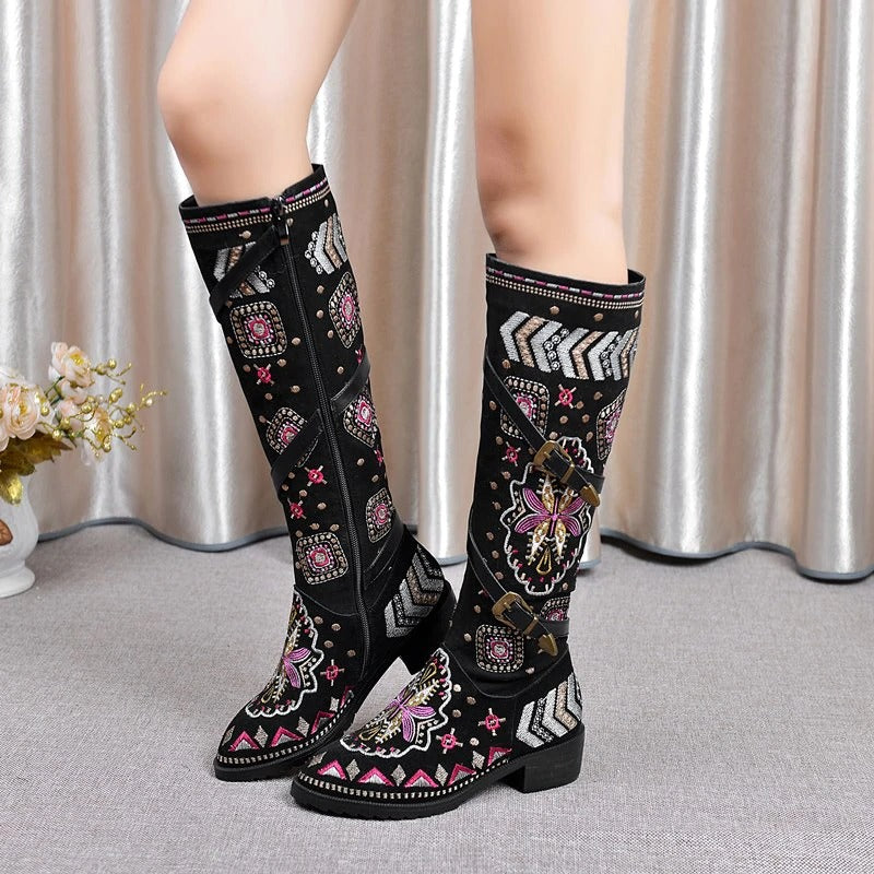 Elegant women's genuine leather western boots, featuring vibrant embroidery and a stylish knee-high design for trendy outfits.