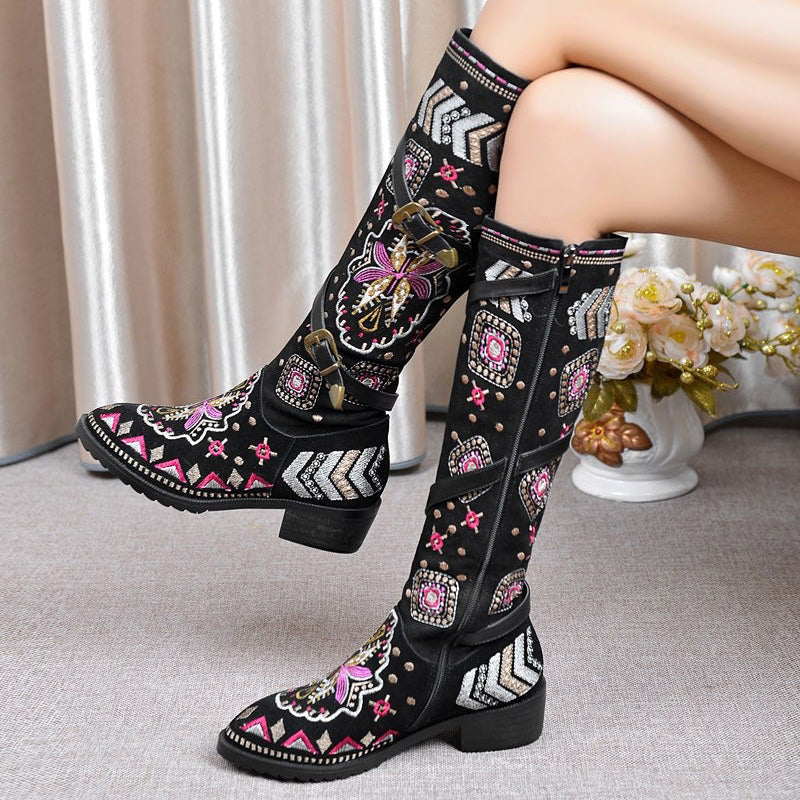 Stylish women's genuine leather western boots with elegant embroidery and vibrant patterns, perfect for edgy outfits.