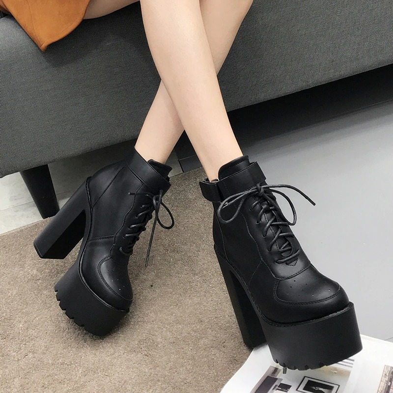 Stylish women's high-heeled lace-up ankle boots in black, perfect for alternative fashion. Platform design and punk-inspired look.