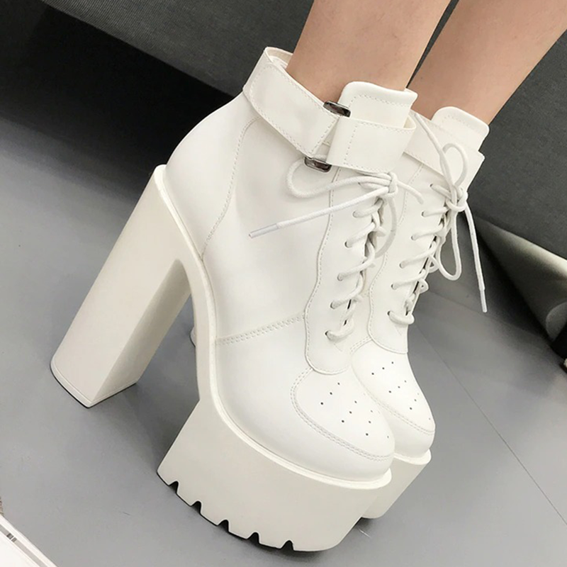Stylish white high-heeled lace-up ankle boots with platform sole, perfect for alternative fashion outfits.