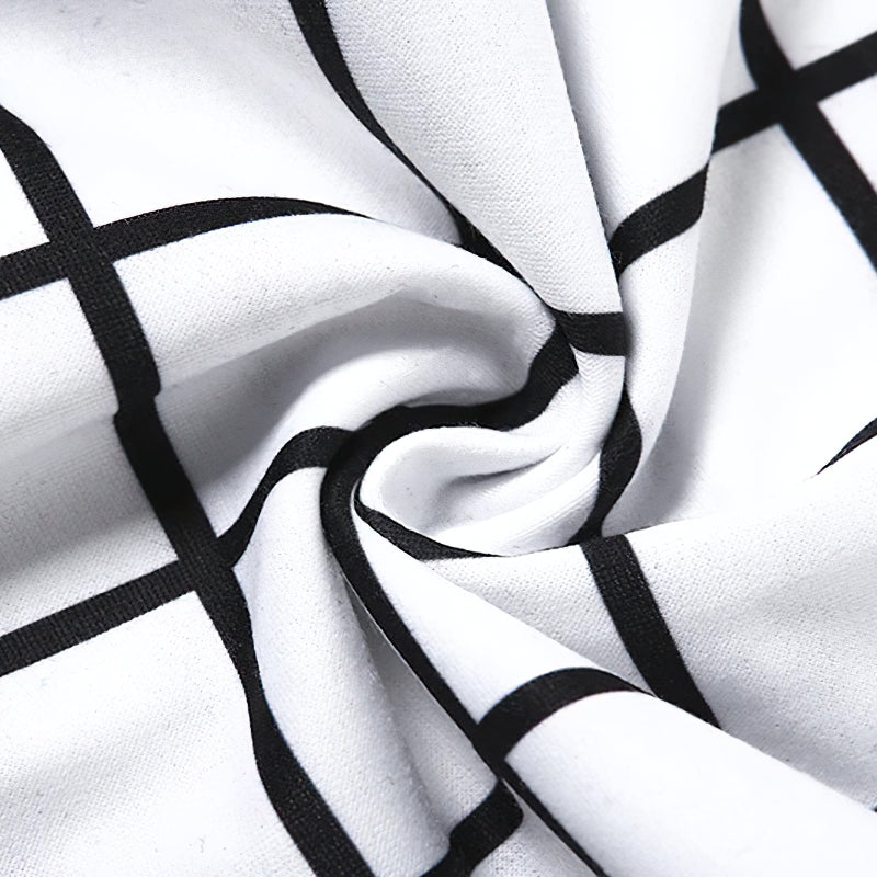 Close-up of black and white checkerboard fabric, perfect for gothic cargo pants with a unique style.