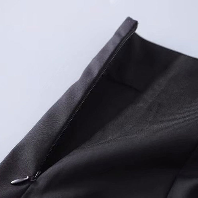 Close-up of the zipper on a black low waist A-line short skirt for girls, showcasing impeccable quality and design.