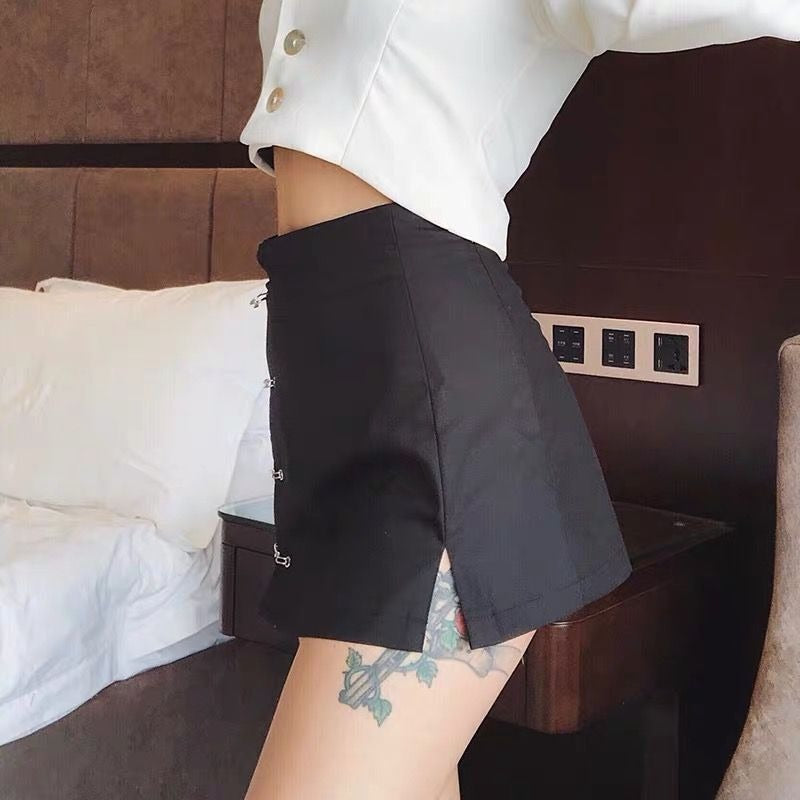 Stylish low waist black A-line short skirt with slit and clips, perfect for a gothic look.