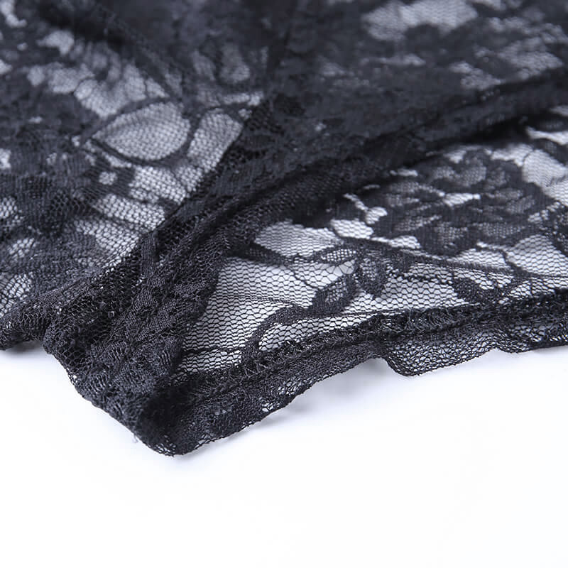 Close-up of black gothic lace fabric featuring intricate floral embroidery, ideal for vintage style clothing.