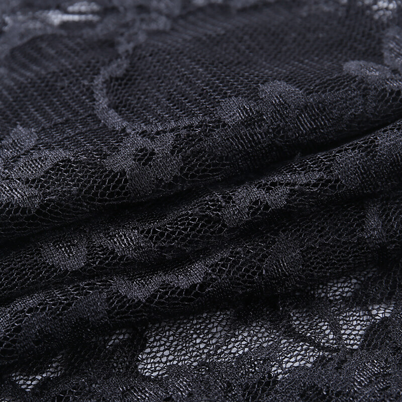 Close-up of elegant black lace fabric with floral pattern, perfect for women's gothic fashion and vintage styles.