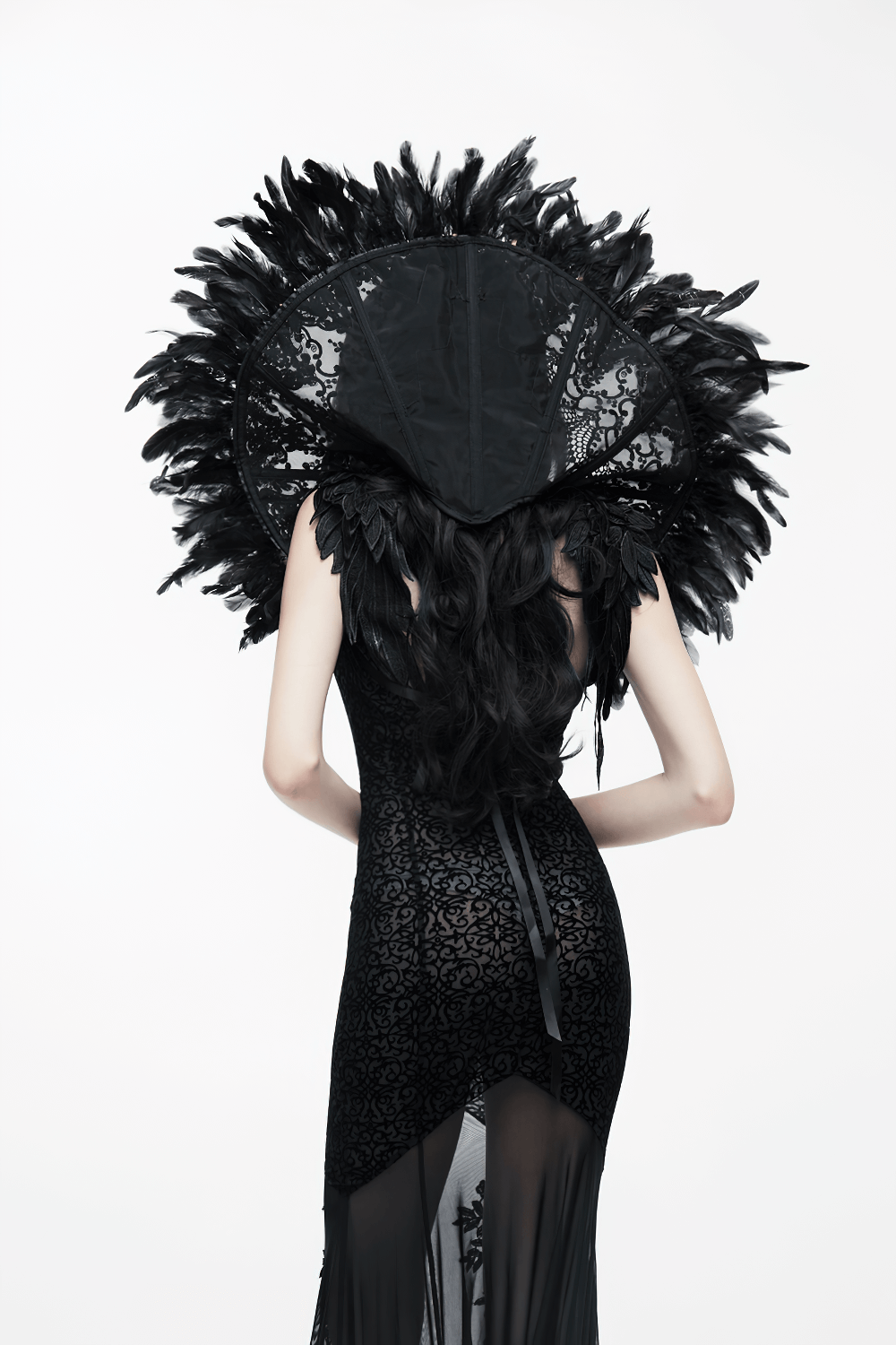Elegant women's gothic long dress with transparent bottom and feathered hood, showcasing a sexy backless design.