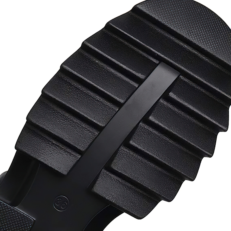 Close-up view of the durable sole of women's Gothic PU leather high sandals, showcasing grooves for traction.