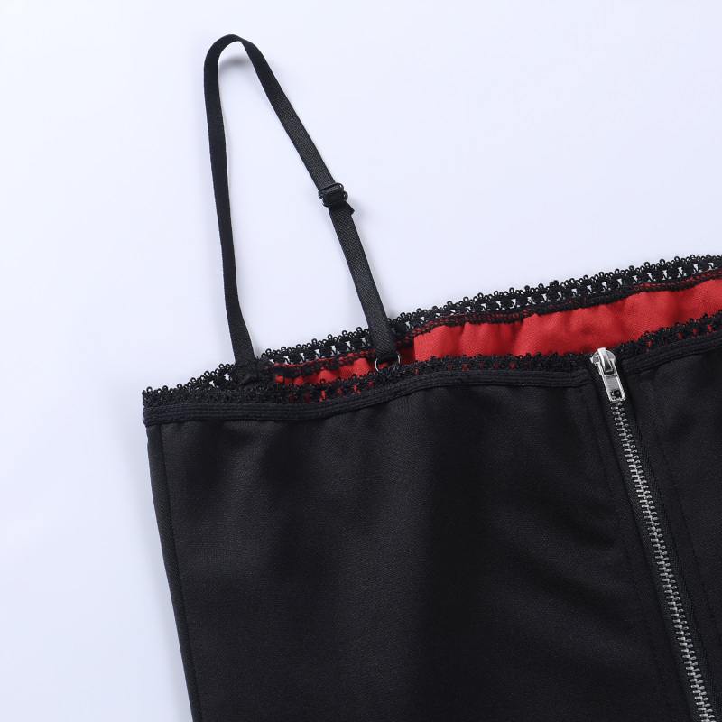 Close-up of women's gothic sleeveless crop top with lace trim and red lining, perfect for vintage grunge style.