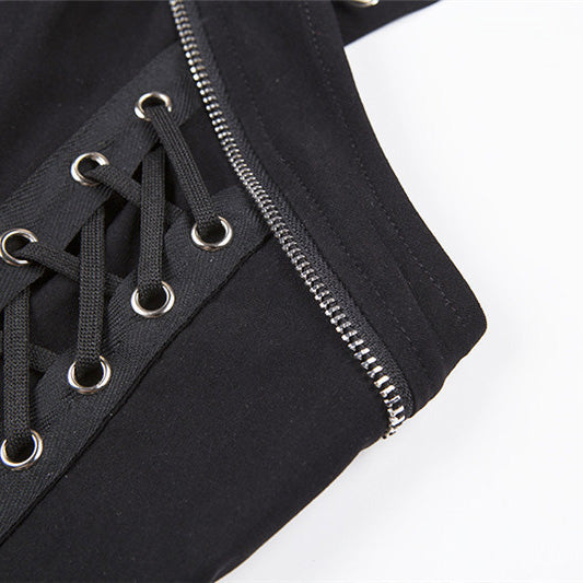 Close-up of women's gothic top featuring lace-up front and zipper detail, perfect for edgy rock outfits.