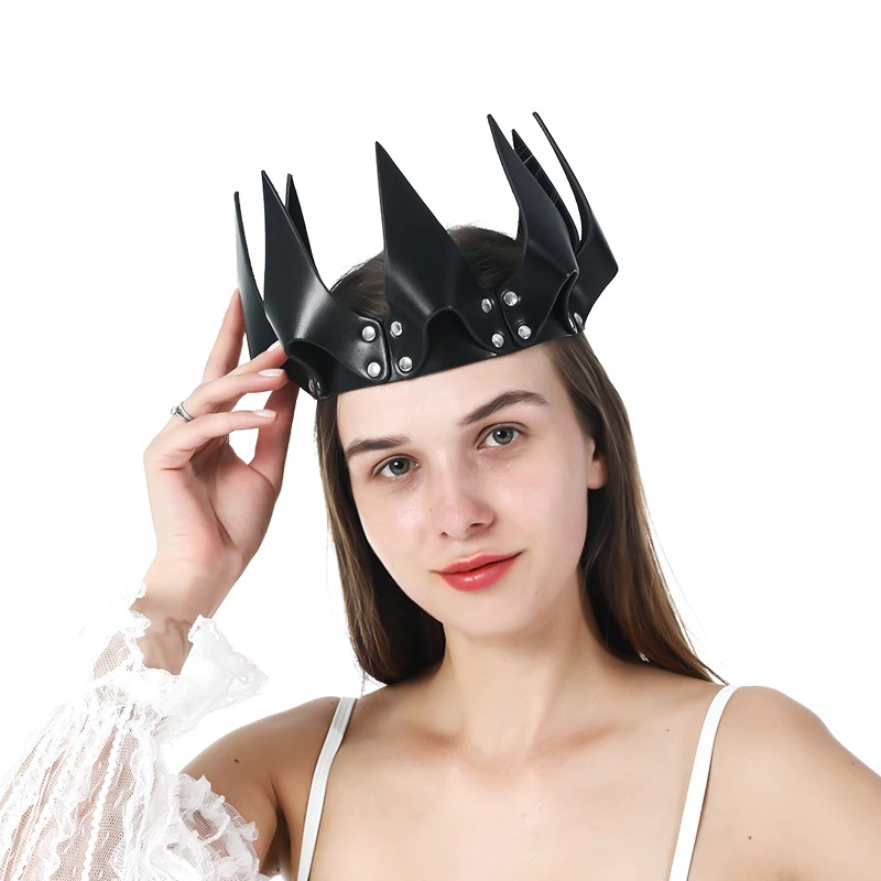 Woman wearing a Gothic PU leather crown head mask with rivets, perfect Halloween accessory for a striking look.