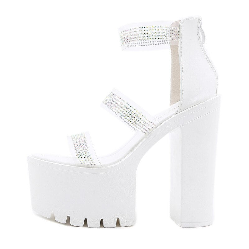 Elegant white heeled sandals with rhinestone straps, perfect for adding style to any aesthetic outfit.