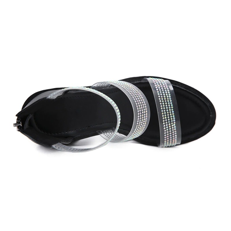 Elegant women's heeled sandals featuring sparkling rhinestones and a stylish transparent design.