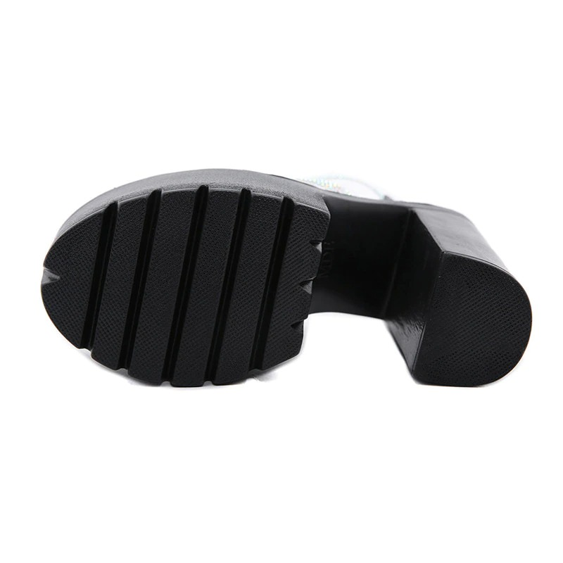 Bottom view of elegant women's heeled sandals featuring a textured sole for style and comfort.