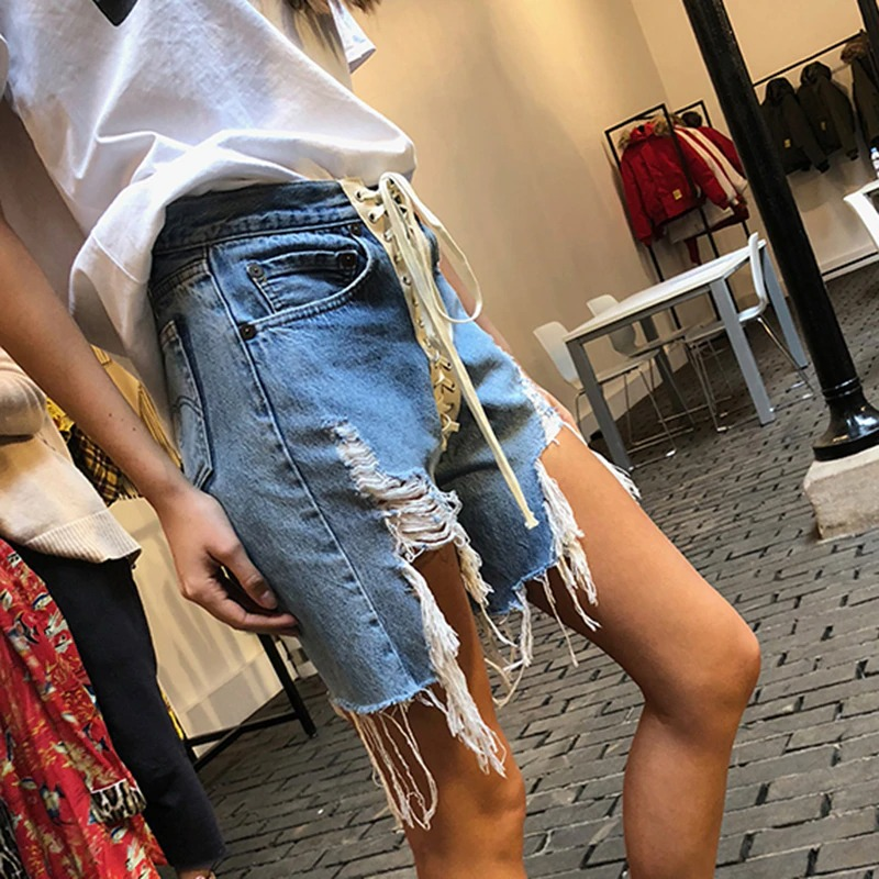 Women’s high waist denim shorts with pockets, laces, and distressed design, perfect for summer fun and casual outings.