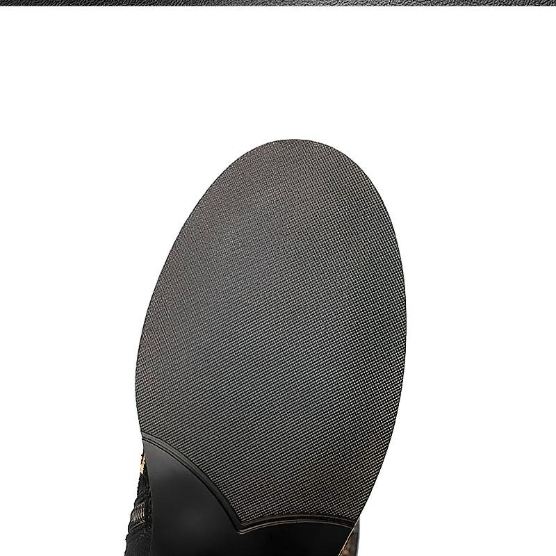 Sole view of women's knee-high leather boots showcasing the textured bottom for optimal grip and comfort.