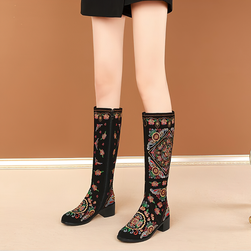 Women's knee-high boots with colorful embroidery and thick heels, showcasing ethnic style and comfort.