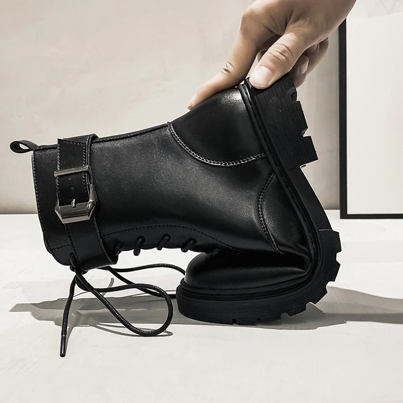 Stylish women's lace-up ankle motorcycle boots with buckle, showcasing flexibility and comfort in black PU leather.