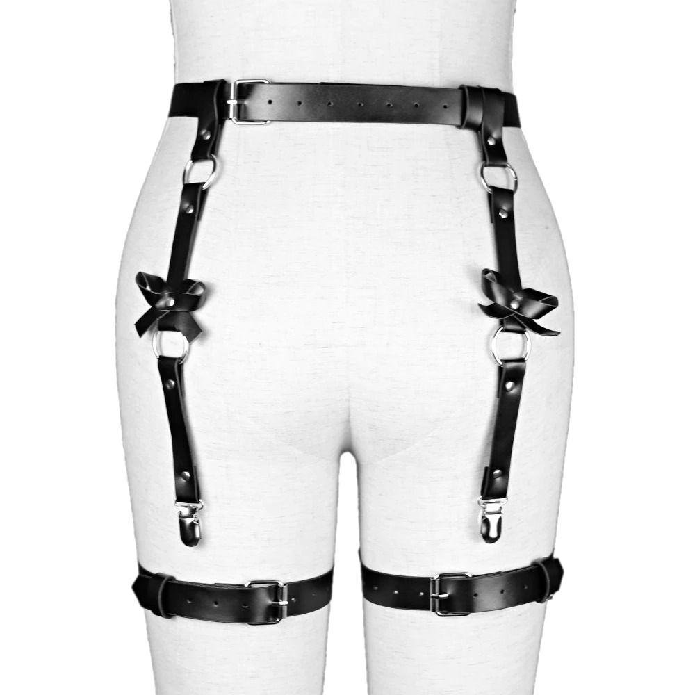 Black leather BDSM body harness with adjustable straps and silver details on a mannequin's back.