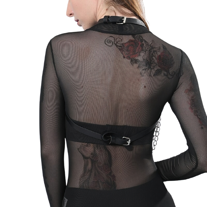 Back view of a woman wearing a sheer top with a black leather BDSM body harness, showcasing gothic style and tattoos.