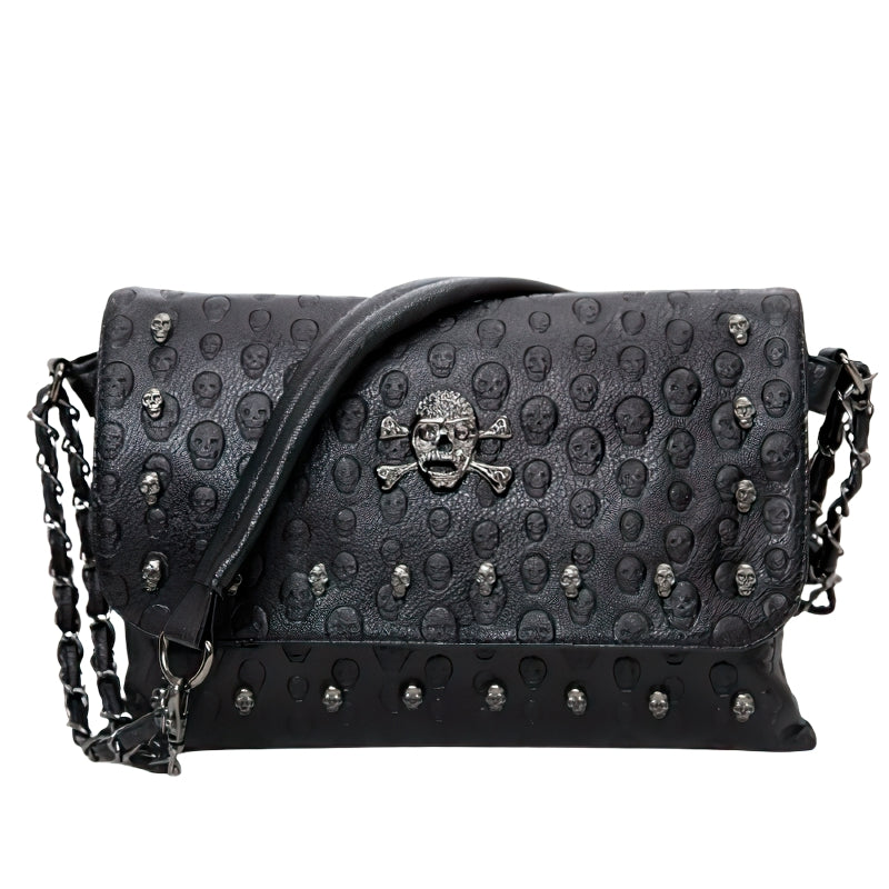 Women's gothic leather handbag with rivet skull design and shoulder strap, perfect for vintage style.