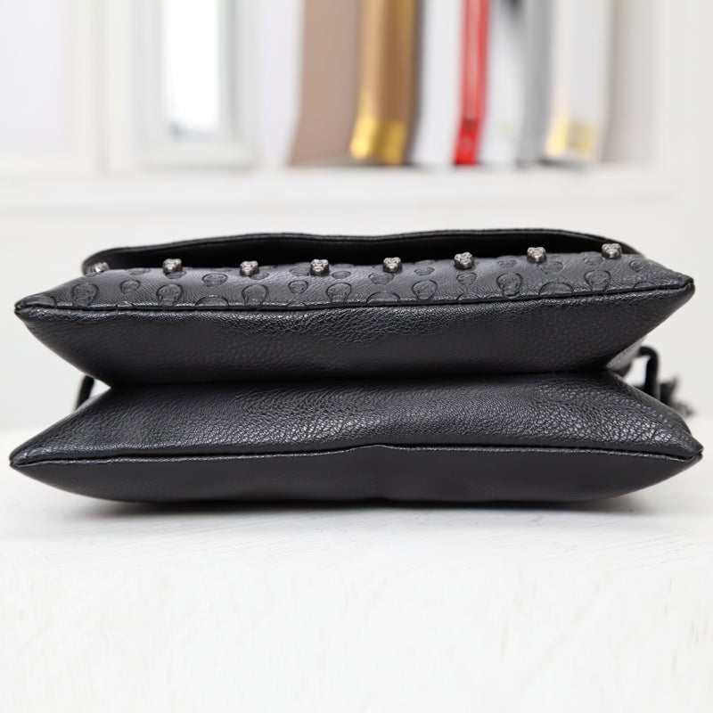 Stylish Women's Leather Gothic Handbag with rivet skull design, showcasing a sleek black finish and unique embellishments.