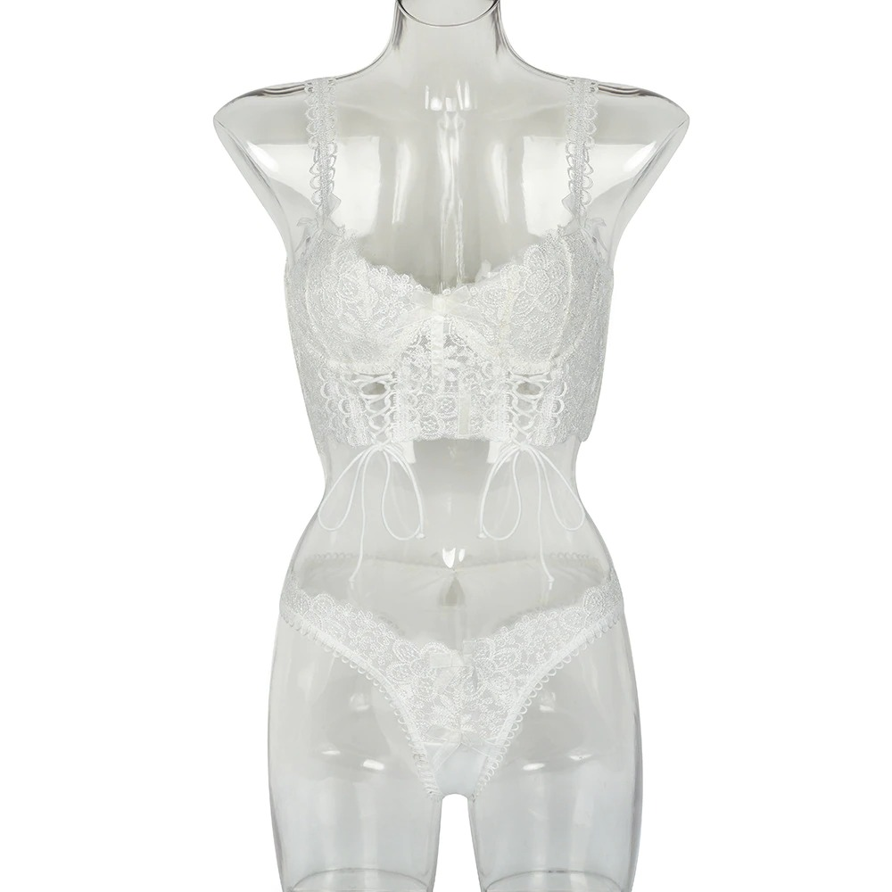 Women's white lace lingerie set featuring a sexy bra and thong on a clear mannequin.
