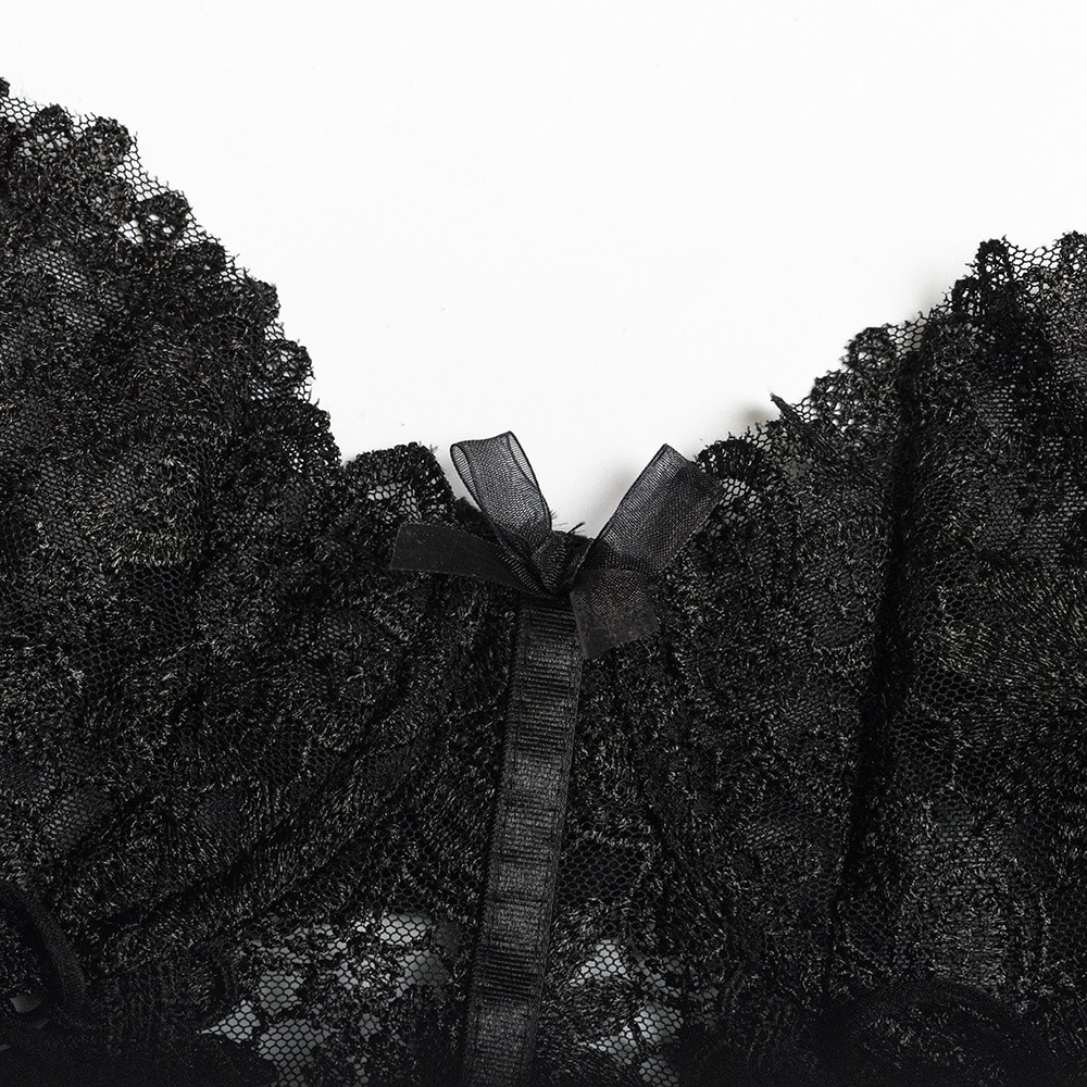 Close-up of a women's gothic lace lingerie set with black lace detailing and a satin bow.