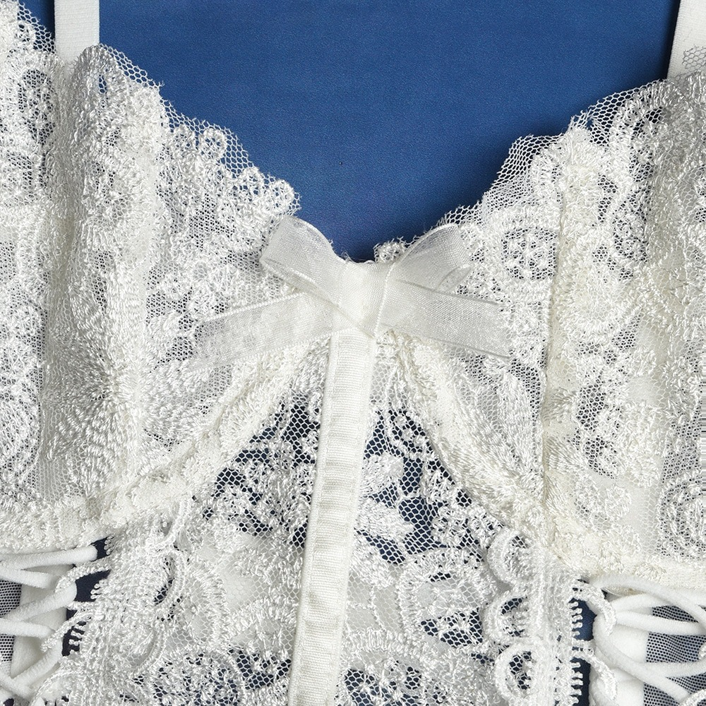 Close-up of a women's gothic lace lingerie top with intricate patterns and a delicate bow detail, perfect for rock style.