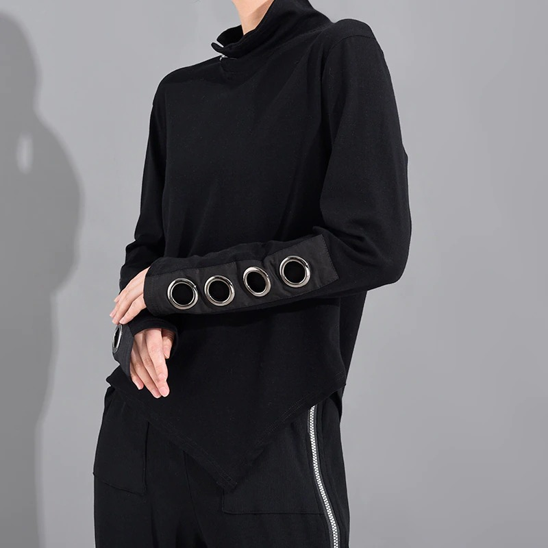 Women's black asymmetrical top with stand collar and hollow out sleeves featuring metal rings.