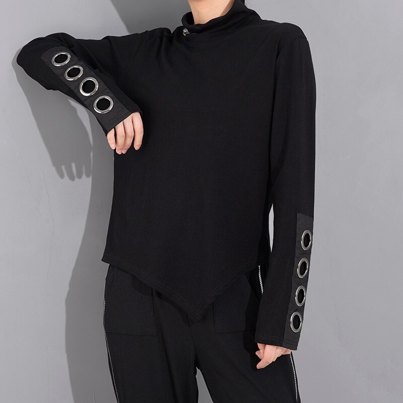 Women's long sleeve black asymmetrical top with stand collar and metal ring details, perfect for alternative fashion looks.
