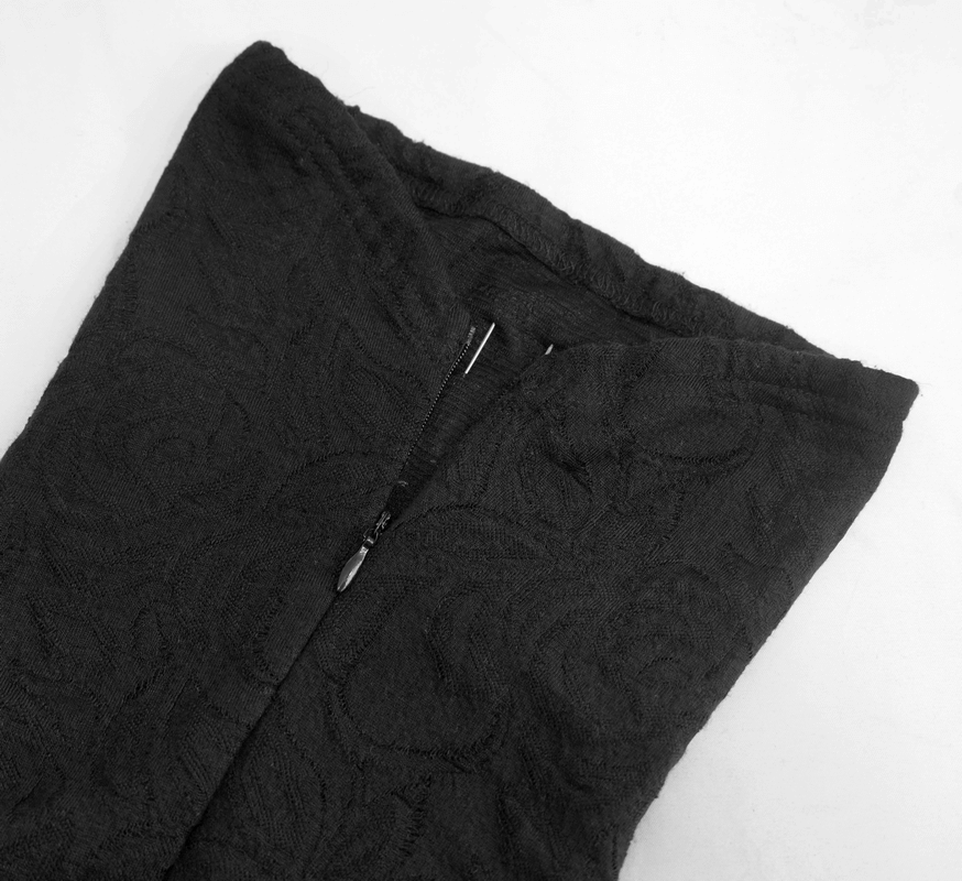 Close-up of a women's gothic black longsleeve top, featuring a stylish zip and textured fabric.