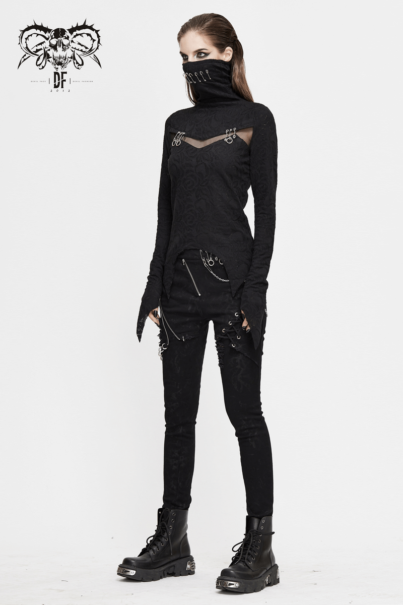 Gothic style black women's long sleeve top with face covering and silver accents, paired with edgy black pants.