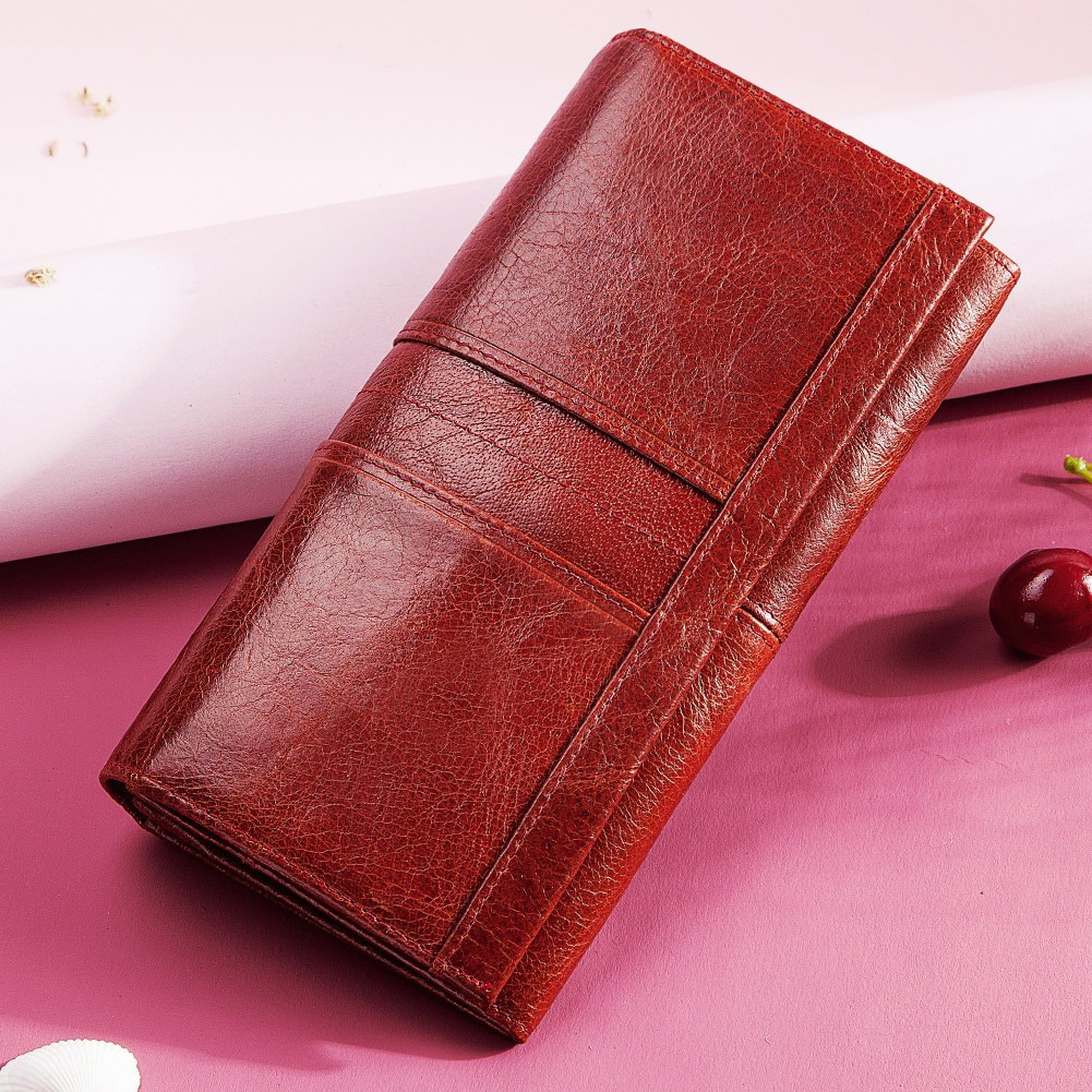 Women's long wallet-clutch in rich red genuine leather with pockets for cell phone and cards.