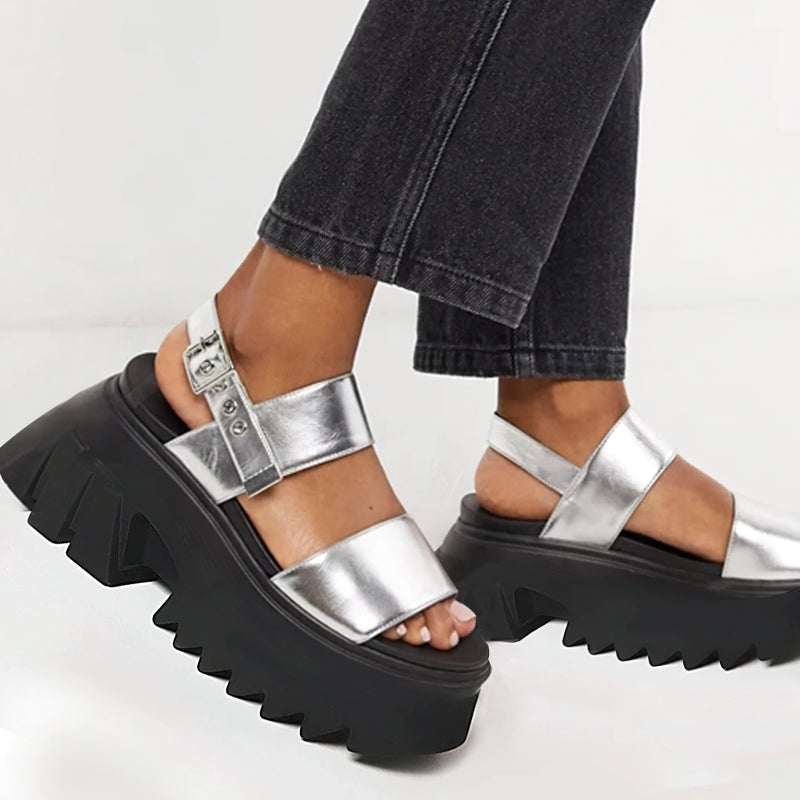 Stylish women's luxury platform chunky sandals with shiny silver straps and black rubber sole, perfect for summer outings.