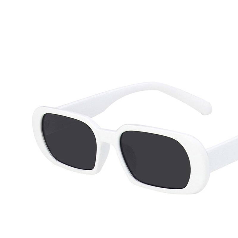 White small oval sunglasses with dark lenses, a trendy luxury accessory for women, offering UV400 protection.
