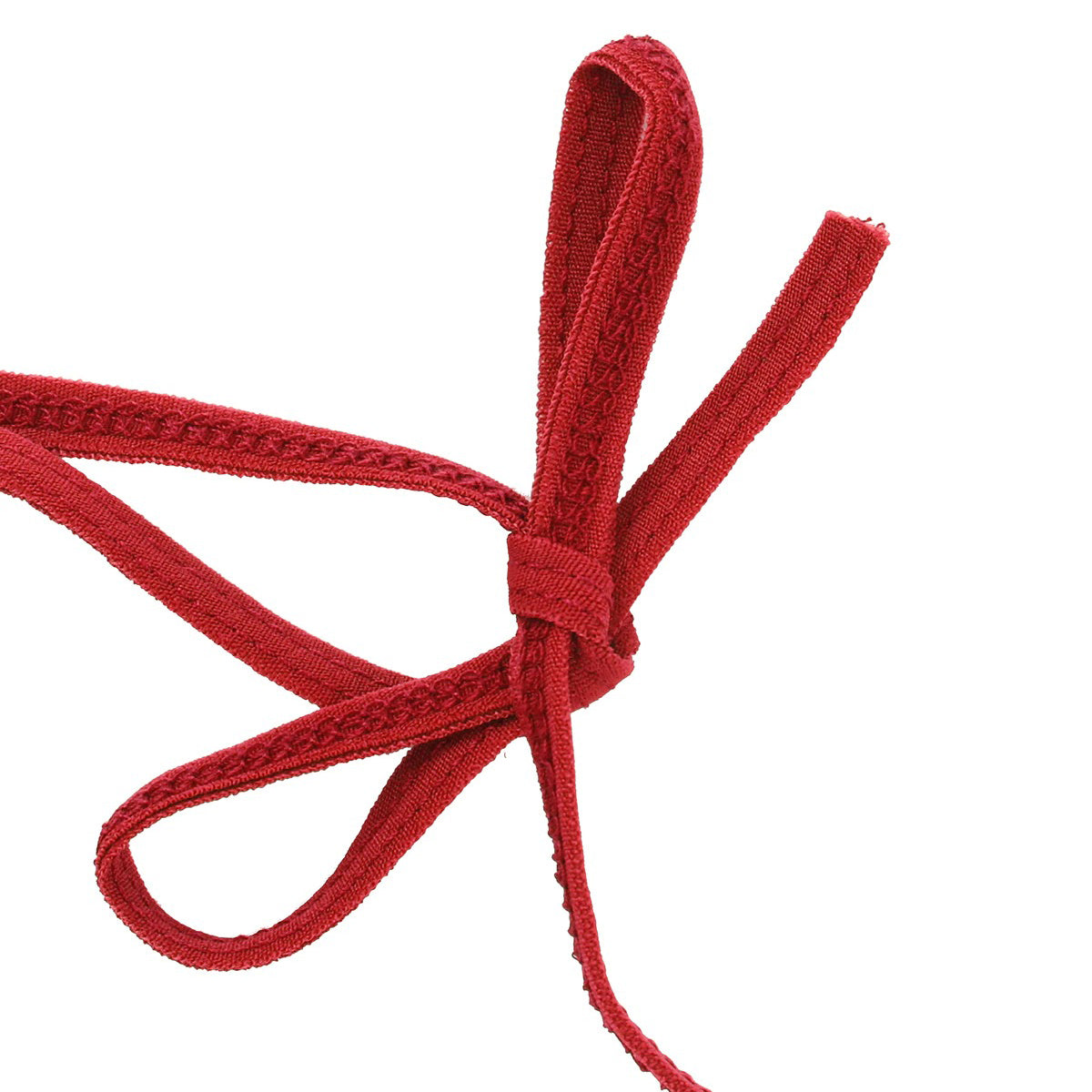 Close-up of a red self-tie string from a micro bikini, showcasing adjustable styling and fashionable detail.