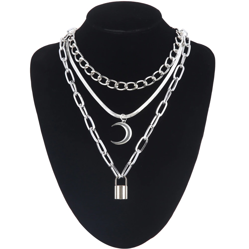 Layered women's gothic style necklace featuring moon and aluminium lock pendants, perfect for trendy outfits.