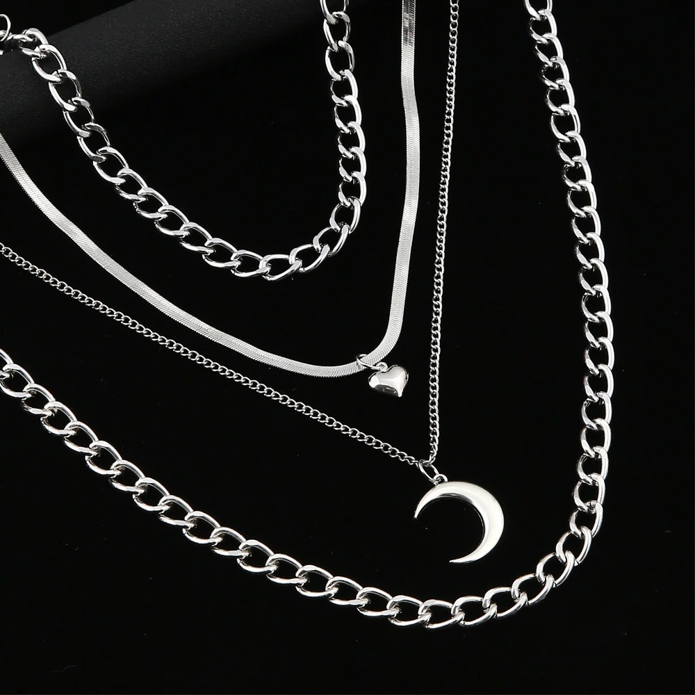Layered women's moon pendant necklace with heart and aluminium lock, perfect for trendy outfits.