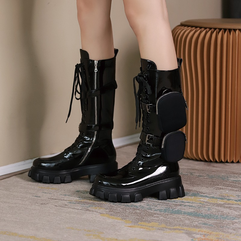 Women's black platform motorcycle boots with pockets, featuring a sleek design in genuine leather.