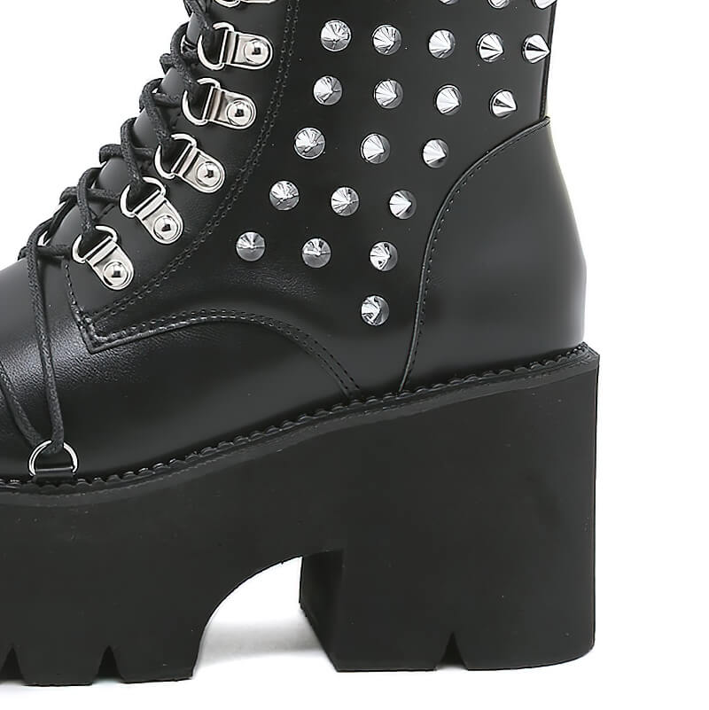 Stylish women's punk motorcycle platform boots with rivets and chunky heel, perfect for a trendy outfit.